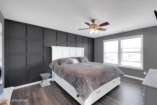 bedroom featuring ceiling fan and dark wood-type flooring