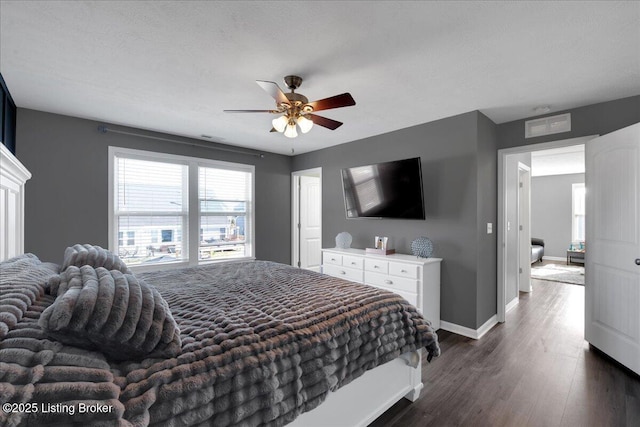 bedroom featuring ceiling fan and dark hardwood / wood-style flooring