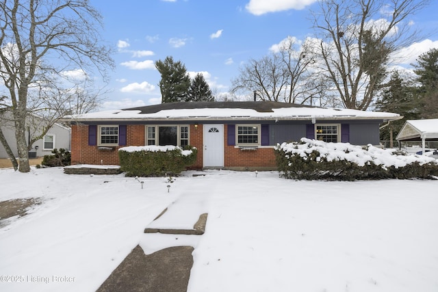 ranch-style home with a garage and brick siding