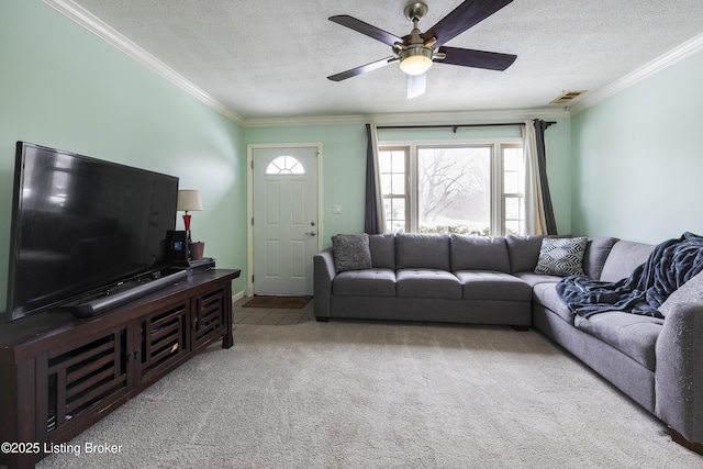 living area with ornamental molding, visible vents, light carpet, and a textured ceiling