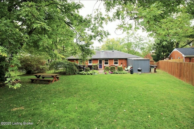 view of yard featuring fence and a deck