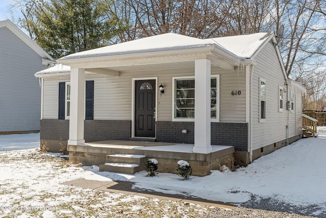 view of front of property with brick siding and a porch