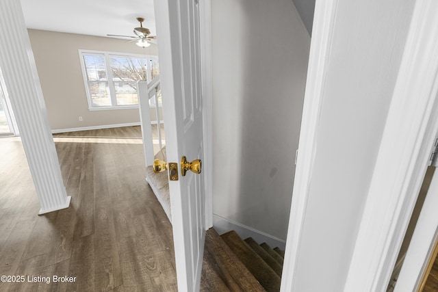 hall with stairway, baseboards, and dark wood finished floors