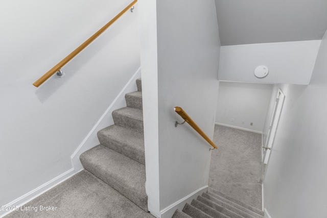 staircase with carpet and baseboards