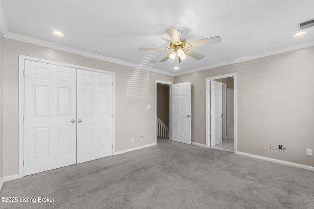 unfurnished bedroom with visible vents, a closet, and ornamental molding