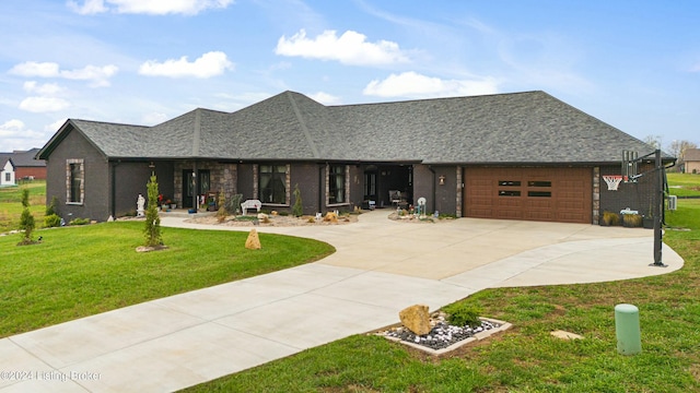 view of front facade featuring a garage, concrete driveway, brick siding, and a front yard