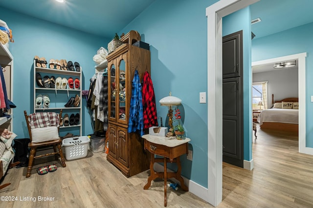 walk in closet with light wood-style floors and visible vents