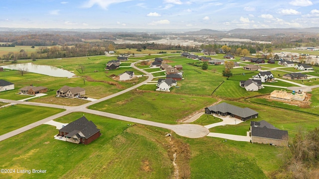 aerial view with a water view and a residential view