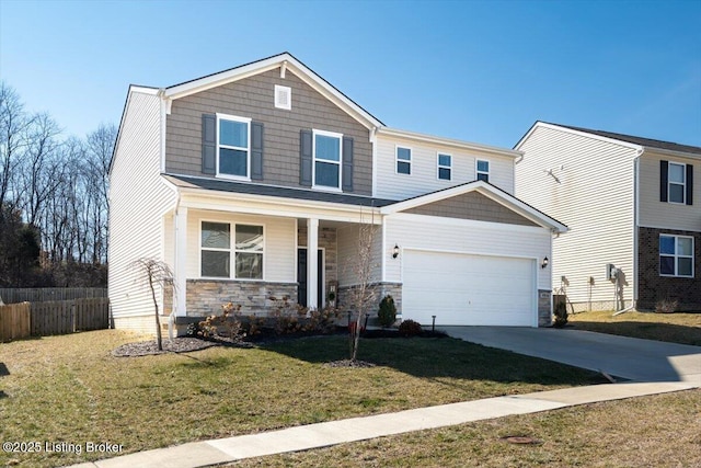 view of front of property featuring covered porch, a front lawn, and a garage