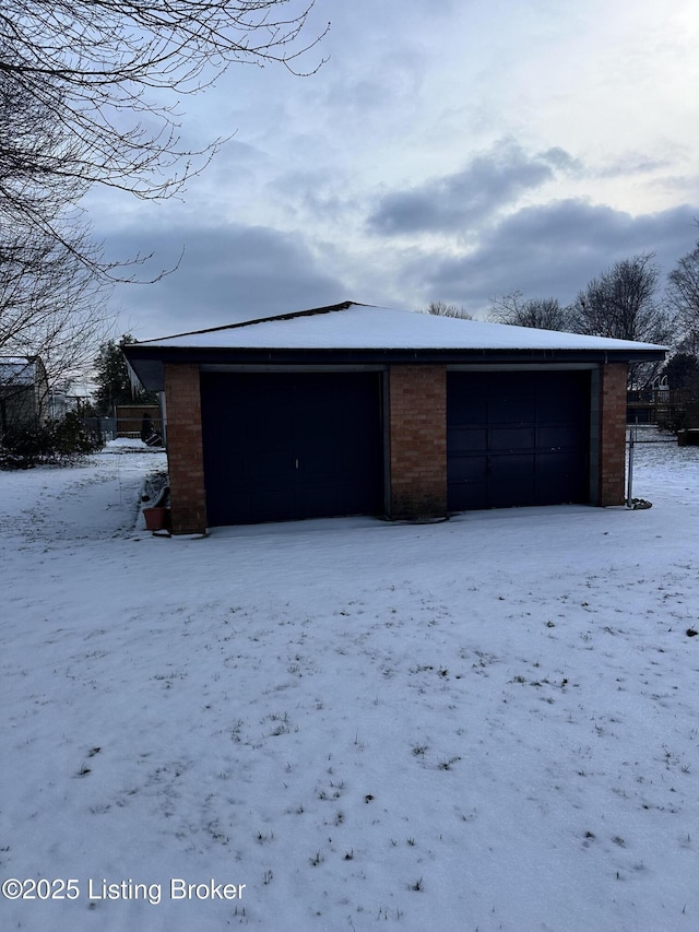 view of snow covered garage