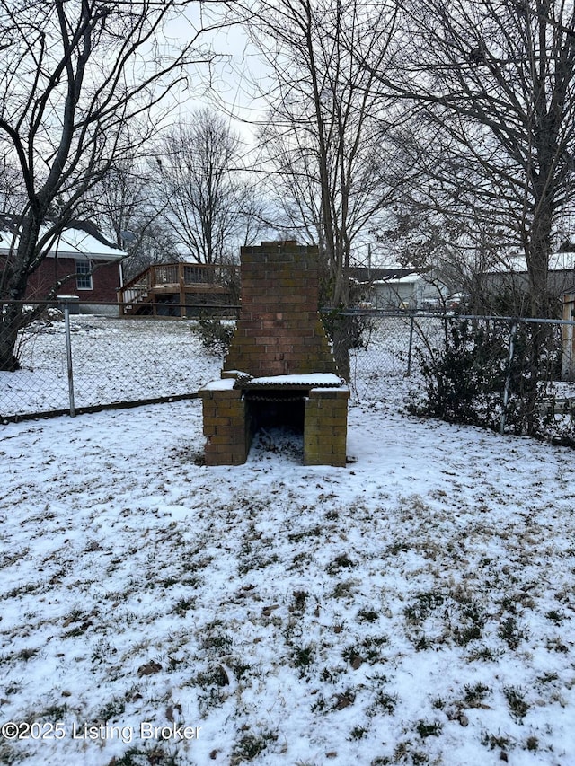 view of yard layered in snow