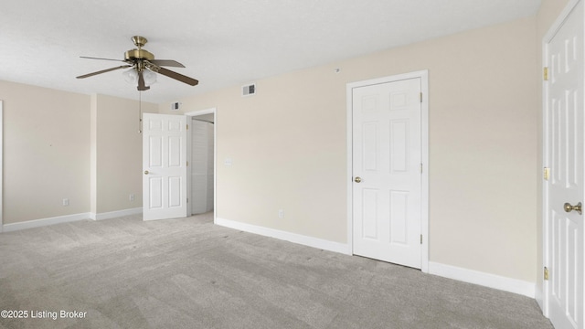 unfurnished bedroom with light carpet and ceiling fan