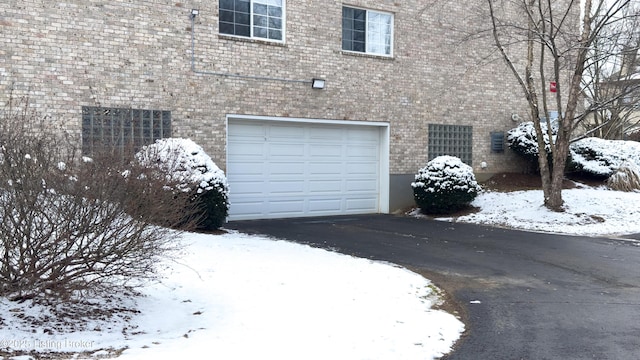 view of snow covered garage