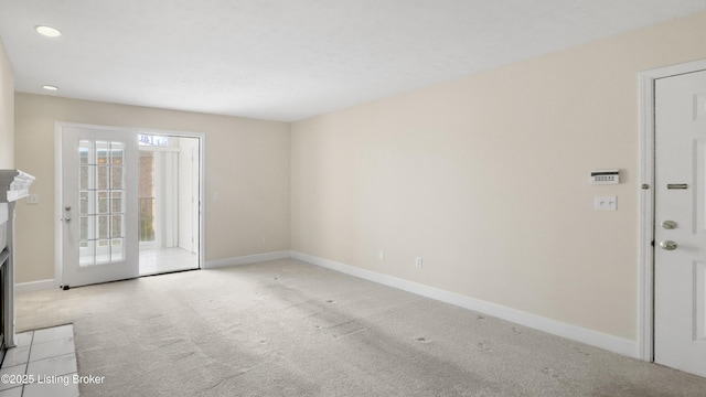 carpeted empty room with a healthy amount of sunlight