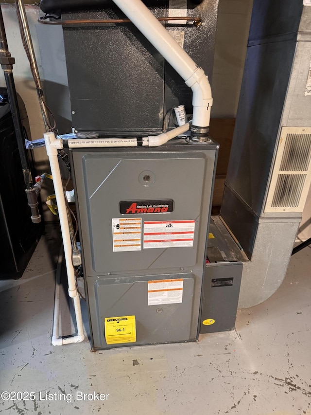 utility room featuring heating unit