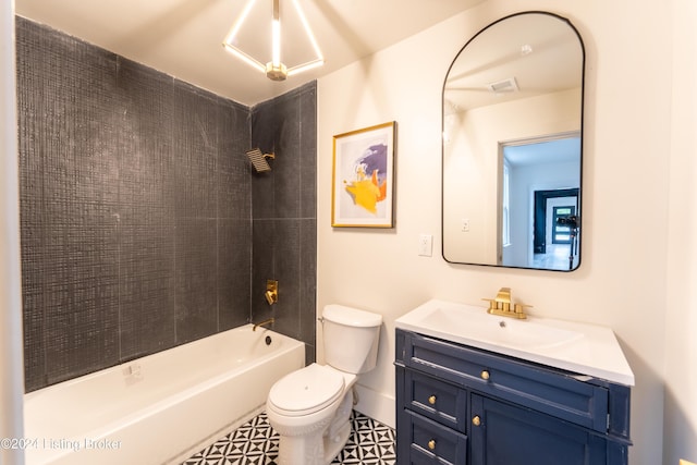 bathroom featuring vanity, shower / tub combination, and toilet