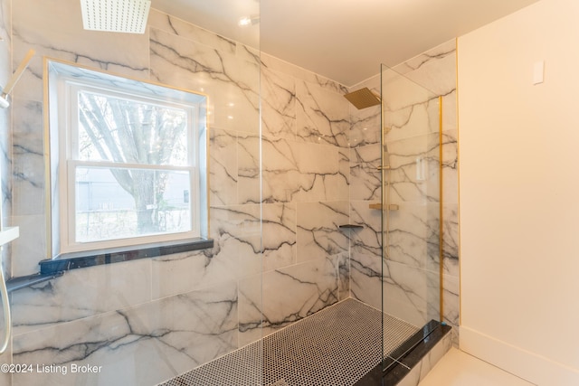 full bath featuring a marble finish shower