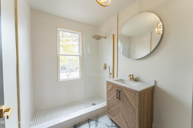 bathroom with a stall shower and vanity