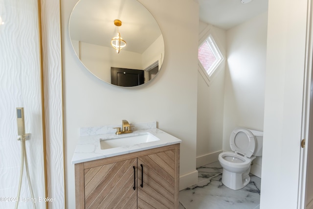 bathroom featuring marble finish floor, toilet, vanity, and baseboards