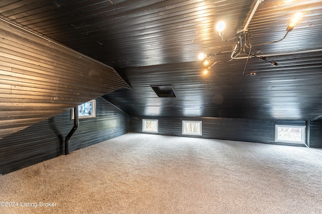 bonus room with carpet floors, wooden ceiling, and lofted ceiling