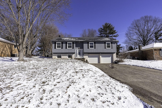 bi-level home featuring a garage