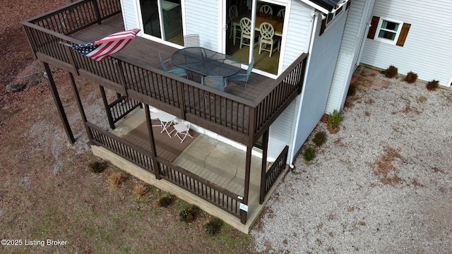 wooden terrace featuring outdoor dining area