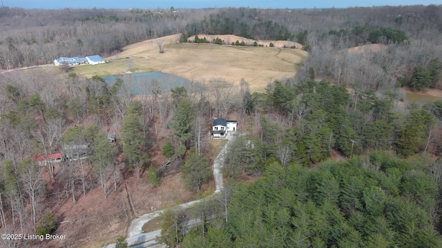 bird's eye view with a forest view and a water view