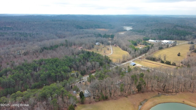 birds eye view of property featuring a water view and a forest view