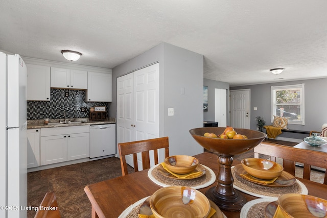 dining area with a textured ceiling