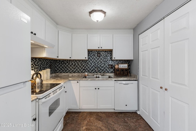 kitchen with white appliances, decorative backsplash, under cabinet range hood, white cabinetry, and a sink