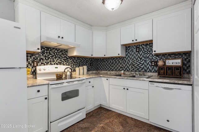 kitchen with white appliances, under cabinet range hood, white cabinets, and a sink