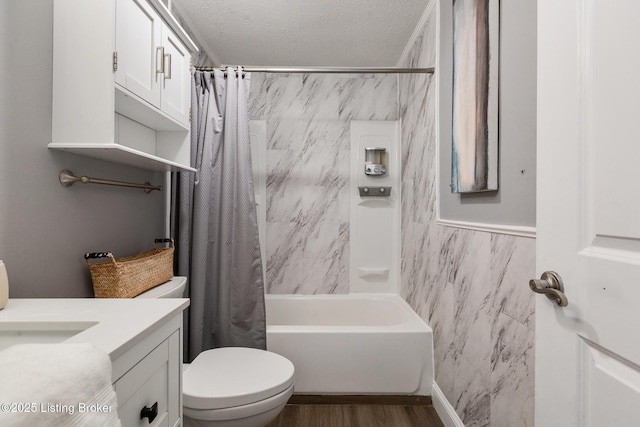 bathroom featuring tile walls, toilet, vanity, a textured ceiling, and wood finished floors