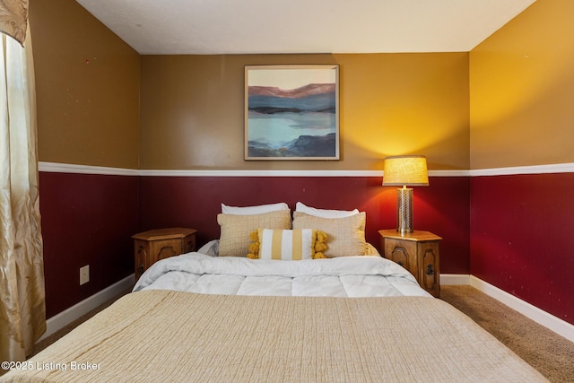 bedroom featuring carpet floors and baseboards