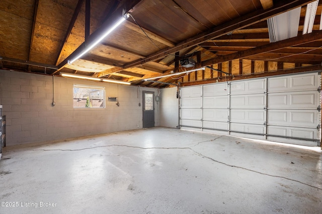 garage with concrete block wall