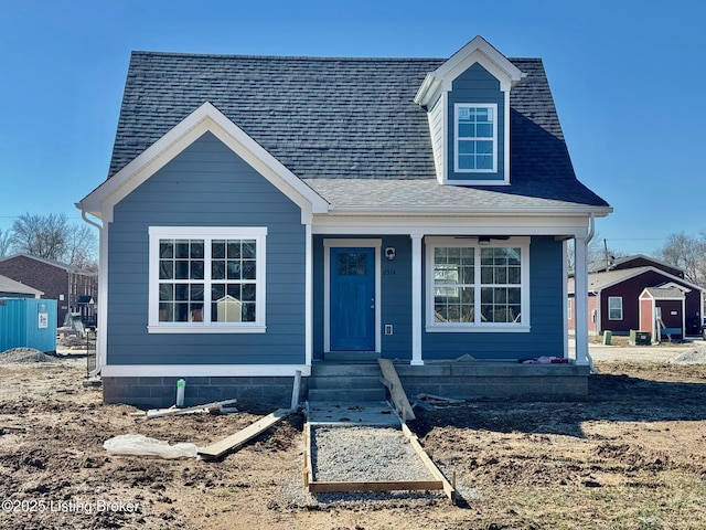 view of front of house featuring roof with shingles