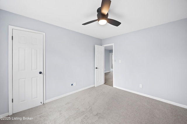 unfurnished bedroom featuring carpet floors, ceiling fan, and baseboards