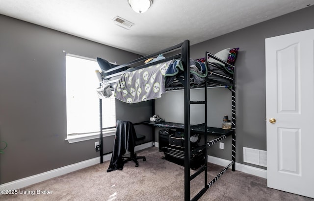 bedroom featuring baseboards, visible vents, and carpet flooring