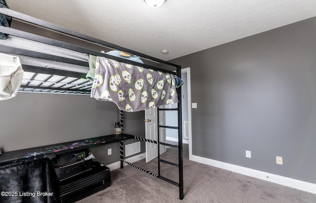 bedroom with carpet, visible vents, and baseboards