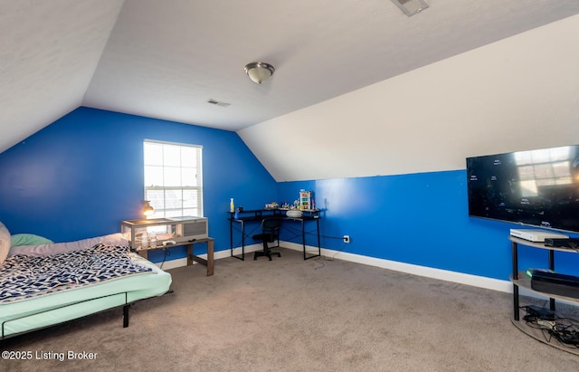 carpeted bedroom featuring baseboards, visible vents, and vaulted ceiling