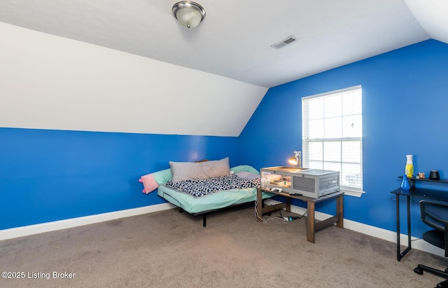 carpeted bedroom featuring baseboards, visible vents, and vaulted ceiling