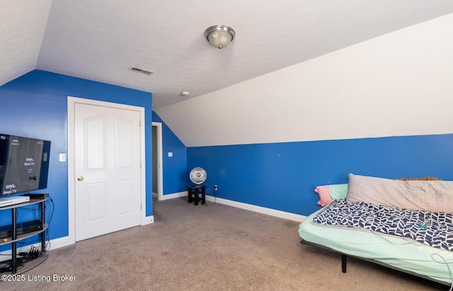 living area featuring lofted ceiling, carpet, visible vents, and baseboards