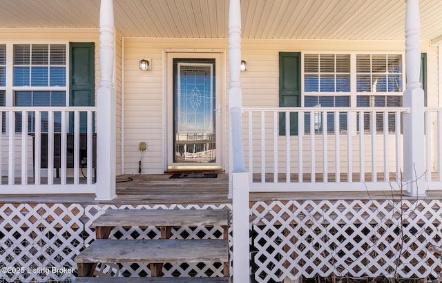 entrance to property featuring a porch