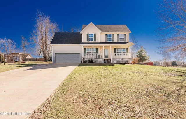 traditional-style home with a chimney, covered porch, concrete driveway, a front yard, and a garage