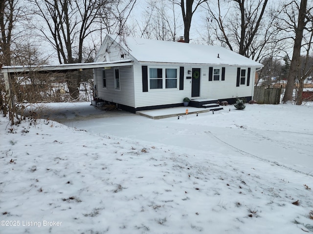 view of front of home featuring a carport