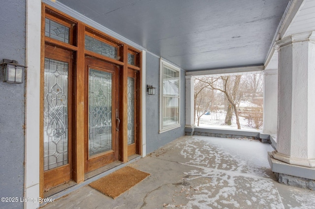 view of snow covered property entrance