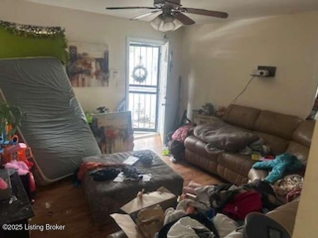 living area featuring a ceiling fan