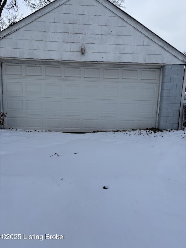 view of snow covered garage