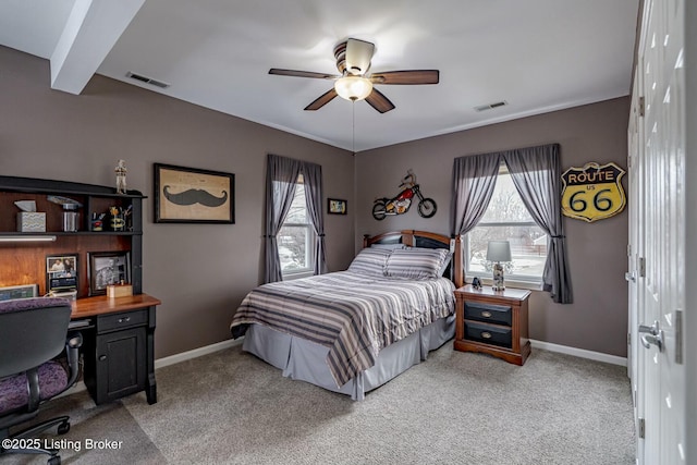 bedroom featuring light colored carpet, visible vents, and baseboards