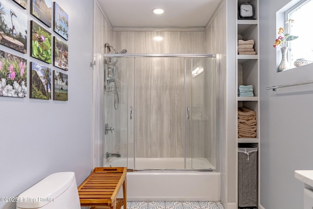 bathroom with toilet and enclosed tub / shower combo