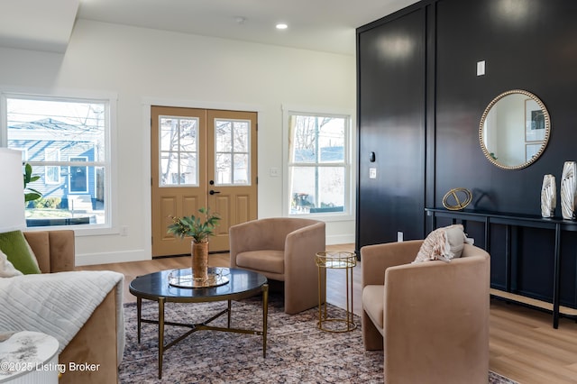 interior space featuring recessed lighting, baseboards, and light wood finished floors